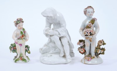 Lot 92 - Bow blanc de chine figure, emblematic of Winter, 13cm high, and two putti, one Bow and the smaller one probably Derby (3)