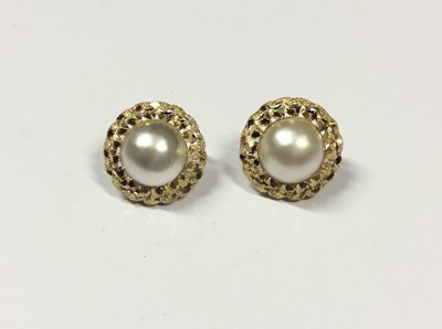 Lot 597 - Pair 9ct gold mounted mabé pearl earrings, each with a large cultured mabé pearl measuring approximately 12mm diameter in 9ct gold stylised pierced setting, the back with hinged post and clip fitti...