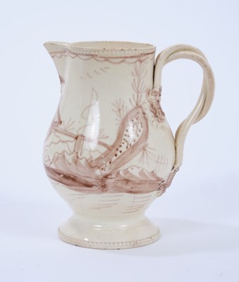 Lot 98 - Late 18th century Creamware pottery jug, the double strap handle issuing from flower and leaf terminals, raised on a pedestal foot with beadwork borders to foot and rim, painted in sepia with a Chi...