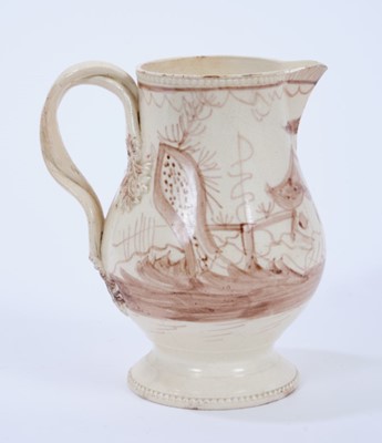 Lot 98 - Late 18th century Creamware pottery jug, the double strap handle issuing from flower and leaf terminals, raised on a pedestal foot with beadwork borders to foot and rim, painted in sepia with a Chi...