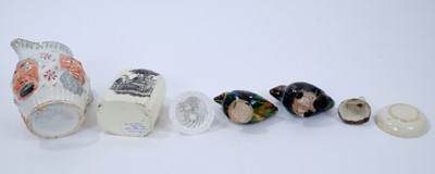 Lot 100 - Small collection of ceramics, including a late 18th century Creamware tea canister with printed decoration after Hancock, a Creamware dish, a Prattware cat, two lead glazed bird whistles and a late...