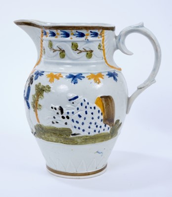 Lot 101 - Prattware pottery jug, c.1800, decorated in relief with a continuous scene representing the nursery rhyme Old Mother Slipper Slopper, 18.5cm high
