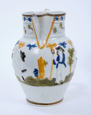 Lot 101 - Prattware pottery jug, c.1800, decorated in relief with a continuous scene representing the nursery rhyme Old Mother Slipper Slopper, 18.5cm high