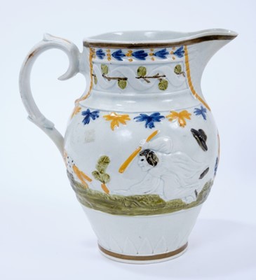 Lot 101 - Prattware pottery jug, c.1800, decorated in relief with a continuous scene representing the nursery rhyme Old Mother Slipper Slopper, 18.5cm high