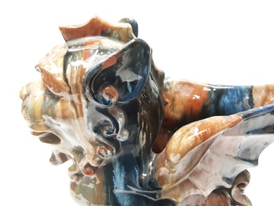Lot 228 - Unusual Victorian glazed pottery model of a dragon, 27cm high and a blue glazed vase (2)