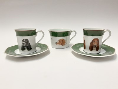 Lot 230 - Two Hermes porcelain cups and saucers depicting dogs - Bassett Hound and Cocker Spaniel, pus a larger cup (5)