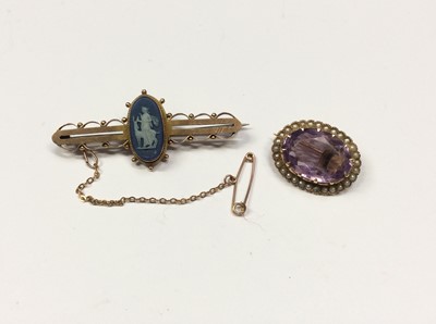 Lot 609 - 9ct gold mounted Wedgwood Jasper ware panel bar brooch depicting a classical female with stag, 45mm, together with an oval mix cut amethyst brooch with seed pearl border, 22mm
