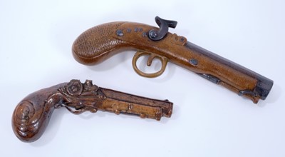 Lot 106 - Two 19th century salt glazed stoneware pistol flasks, the first with impressed mark for J Bourne of Derby, 20cm and 25cm long