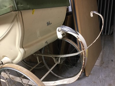Lot 1123 - Vintage Wilson silver cross type pram in cream with a green hood
