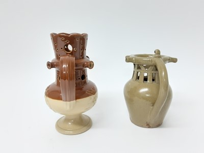 Lot 112 - Two salt glazed stoneware puzzle jugs, one in Doulton style and the other plain, both unmarked, 21.5cm and 18.5cm high