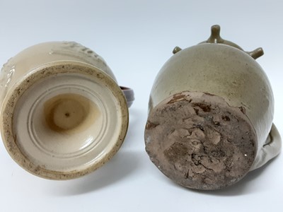 Lot 112 - Two salt glazed stoneware puzzle jugs, one in Doulton style and the other plain, both unmarked, 21.5cm and 18.5cm high