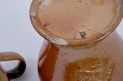 Lot 120 - Salt glazed pottery stoneware, including a beaker with sterling silver mounted rim, a tobacco or snuff jar with portrait of a woman taking snuff, blank cartouche above, and two tankard with hunting...