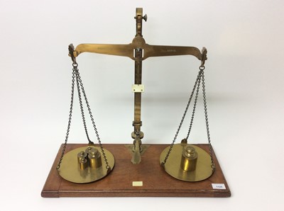 Lot 1125 - Edwardian lacquered brass weighting scales by De Grave & Co Ltd, marked County of Herts, together with some weights