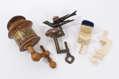 Lot 703 - Rare 19th century sewing clamp, with pin cushion surmount and printed reserve of Brighton sea front, and motto 'A Gift From Brighton', 15cm high, together with three fu...