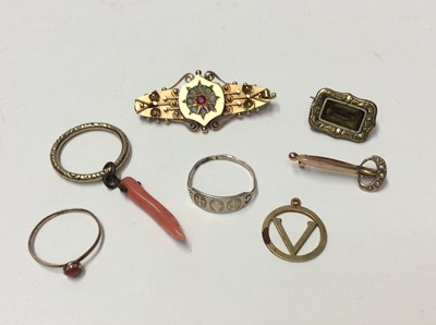 Lot 620 - Victorian 9ct gold brooch set with a central ruby surrounded by a border of eight opals, 42mm long, together with a Georgian coral ring, one other ring with a coral hanging pendant, 9ct gold V init...