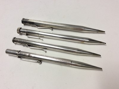 Lot 630 - Two silver propelling pencils and two plated pencils (4)