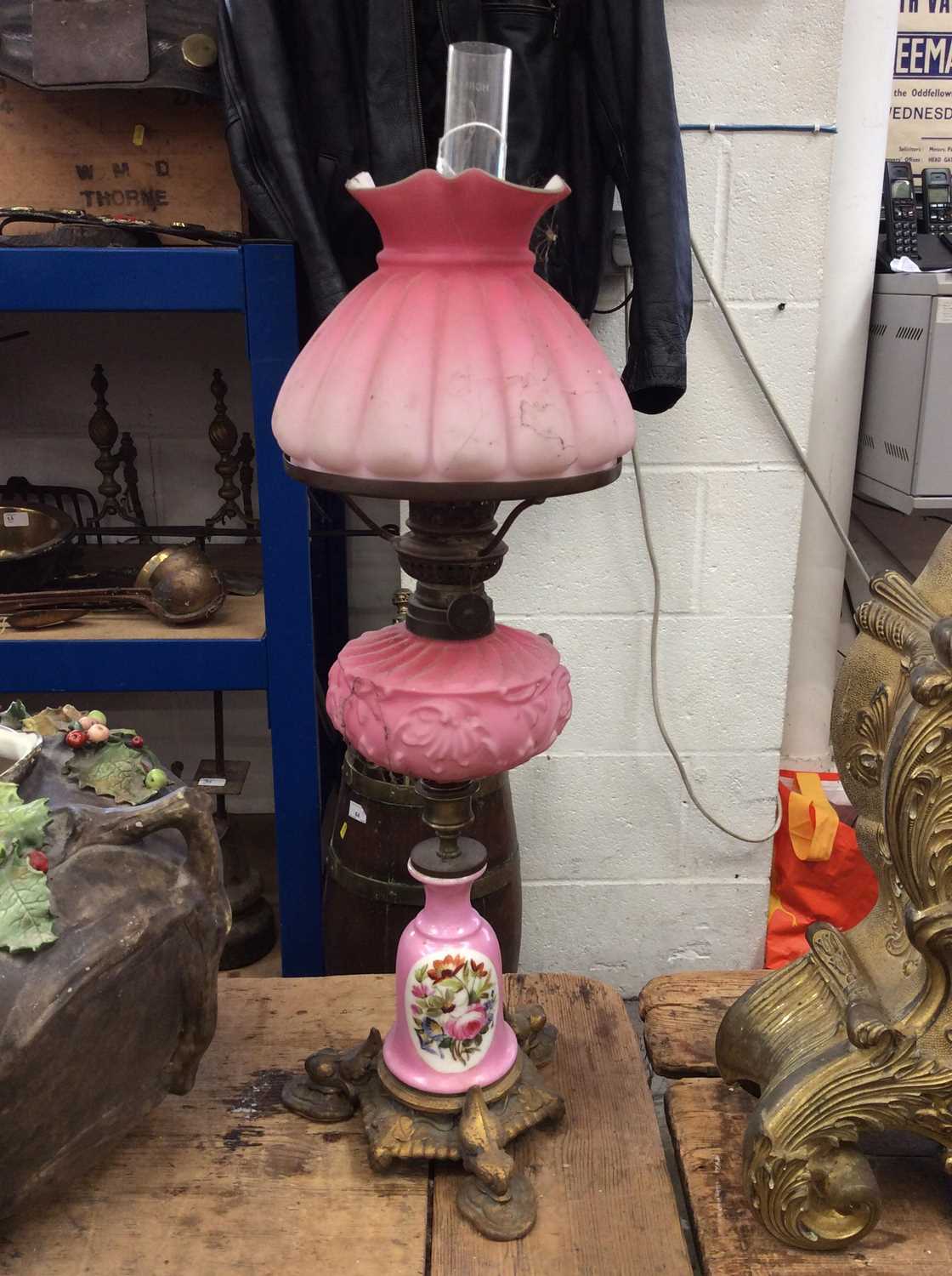 Lot 77 - 19th Century oil lamp with hand painted floral decoration, frosted pink glass reservoir and shade