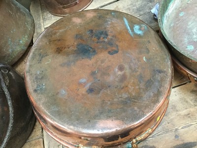 Lot 87 - Two large antique copper preserve pans together with a copper coal bucket (3)