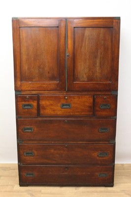 Lot 1412 - Rare and good quality 19th century mahogany Campaign linen press on chest, with fitted slides above a secretaire drawer and two short and three long drawers