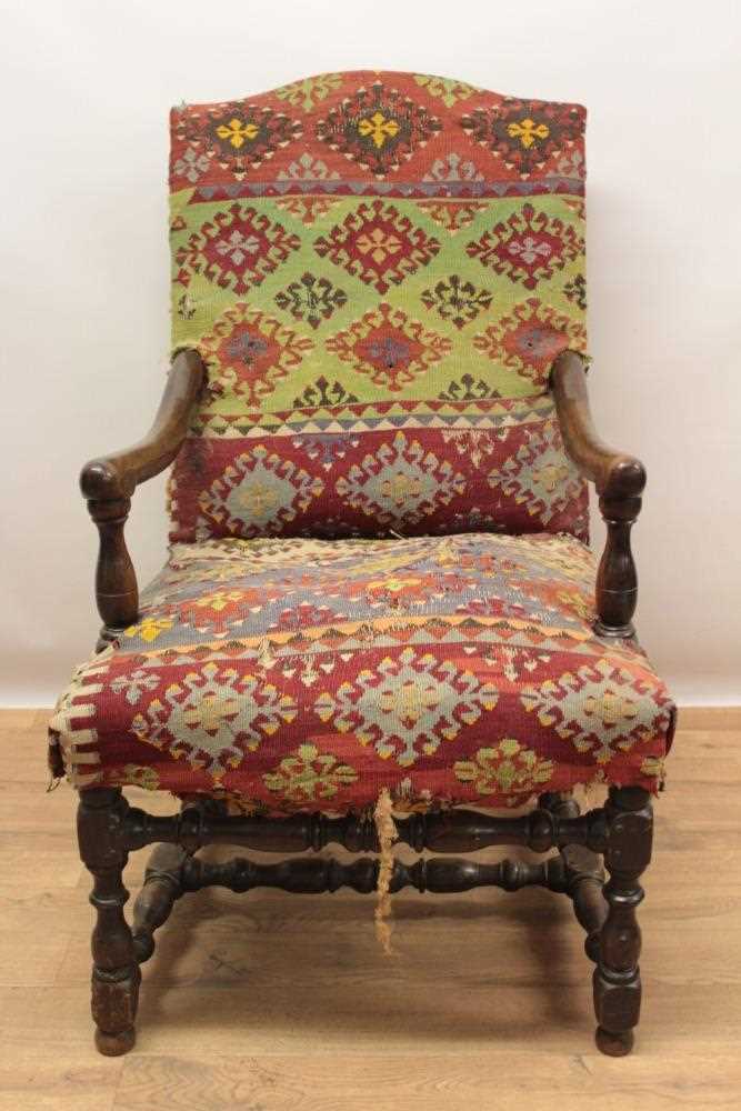 Lot 1347 - Good 17th century walnut armchair, the arched back and seat with Kelim upholstery on turned and block understructure