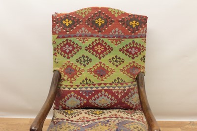 Lot 1347 - Good 17th century walnut armchair, the arched back and seat with Kelim upholstery on turned and block understructure