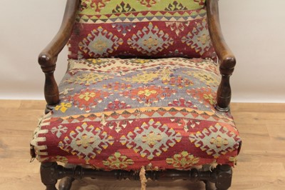 Lot 1347 - Good 17th century walnut armchair, the arched back and seat with Kelim upholstery on turned and block understructure