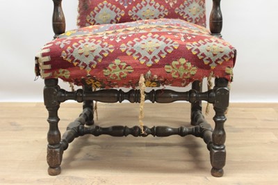 Lot 1347 - Good 17th century walnut armchair, the arched back and seat with Kelim upholstery on turned and block understructure