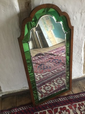 Lot 1509 - Art Deco walnut and coloured glass wall mirror, stepped arched form with green peripheral plates, 81 x 40.5cm