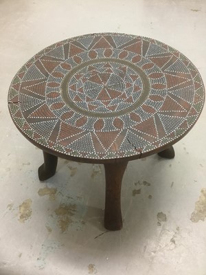 Lot 1517 - Antique African hardwood and bead inset stool, circular top on tripod base, 41cm diameter