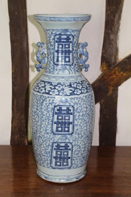 Lot 1525 - Large 19th century Chinese blue and white baluster vase, with twin pierced handles and geometric panels within meandering foliate ornament, 61cm high