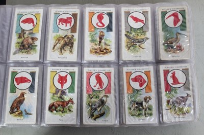 Lot 137 - Cigarette cards - Two blue binders (Nos 3/4) containing a large selection of miscellaneous cards.