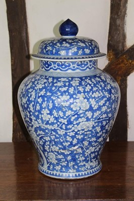 Lot 1530 - 18th century blue and white baluster vase and cover, with prunus blossom decoration, 51cm high