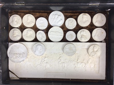 Lot 1544 - Collection of 19th century Italian grand tour plaster medallions, and large plaque, housed within a grained wooden case