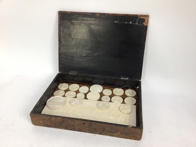 Lot 1544 - Collection of 19th century Italian grand tour plaster medallions, and large plaque, housed within a grained wooden case