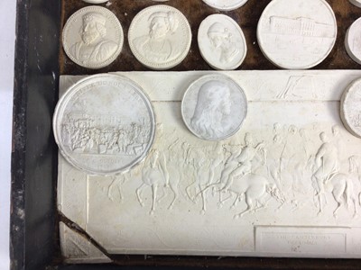 Lot 1544 - Collection of 19th century Italian grand tour plaster medallions, and large plaque, housed within a grained wooden case