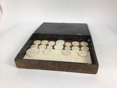 Lot 1544 - Collection of 19th century Italian grand tour plaster medallions, and large plaque, housed within a grained wooden case