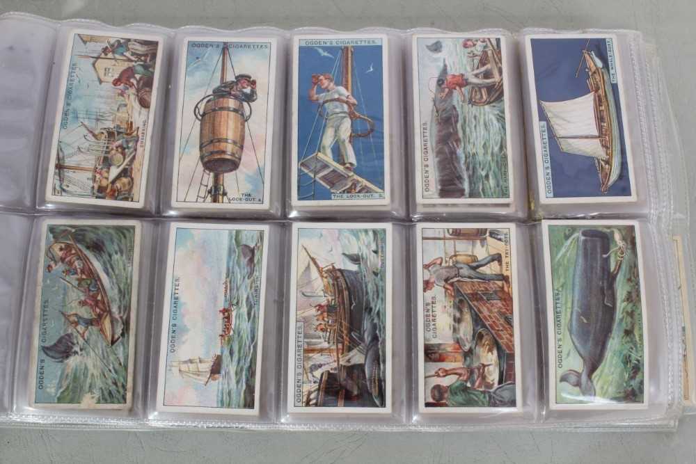 Lot 139 - Cigarette cards - A blue binder (No 6) containing eight complete sets of  cigarette cards.