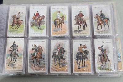 Lot 139 - Cigarette cards - A blue binder (No 6) containing eight complete sets of  cigarette cards.