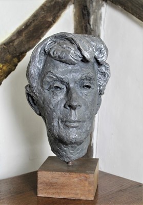 Lot 1557 - Adele Barton (1911-2013) plaster bust - Quentin Crisp, raised on wooden plinth, RA summer exhibition label to base, 43cm high