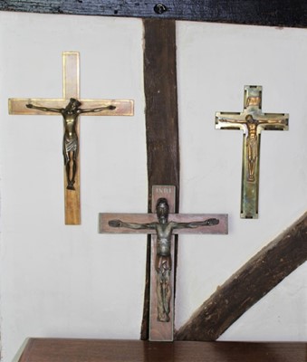 Lot 1564 - Continental carved wooden crucifix, with polychrome detail, 40cm high, together with a brass and wooden crucifix and another (3))