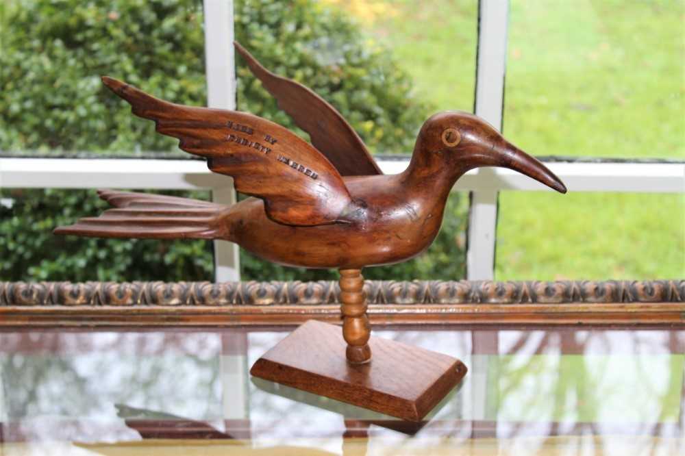 Lot 1567 - Pitcairn Island carved wooden bird figure, stamped Made by Christy Warren, Pitcairn Island, 42cm long