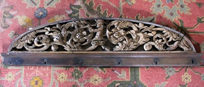 Lot 1572 - 18th century Dutch carved pierced wooden pediment, centred by figure with trumpet and scrolling surround, 93 x 23cm together with a Georgian tromp-l'oeuil painted section of panelling