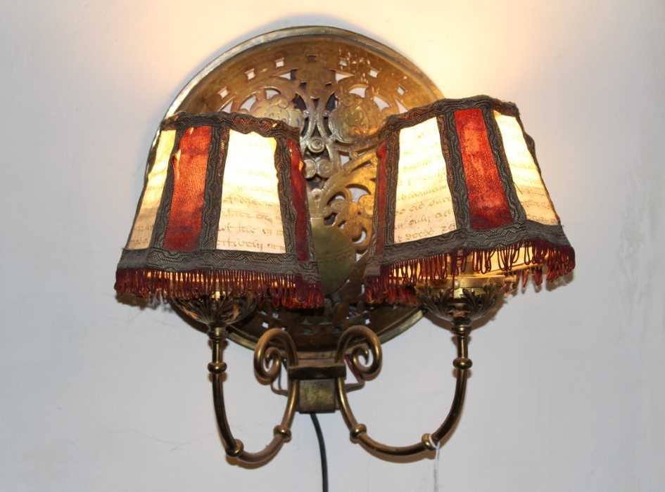 Lot 144 - Pair of brass twin branch wall lights, each with domed panel, formed from warming pan covers