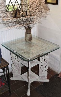 Lot 1576 - Indian white painted carved side table, with square top on pierced carved bracket supports and undertier, 66cm