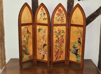 Lot 1577 - Early 20th century painted wooden four folding fire screen, each arched panel painted with animals and flowers, each panel 71cm high x 20cm wide