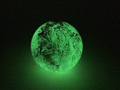 Lot 1587 - Curious specimen quartz sphere, when heat activated glows green in your hands, possibly a dragon's egg? 7cm diameter