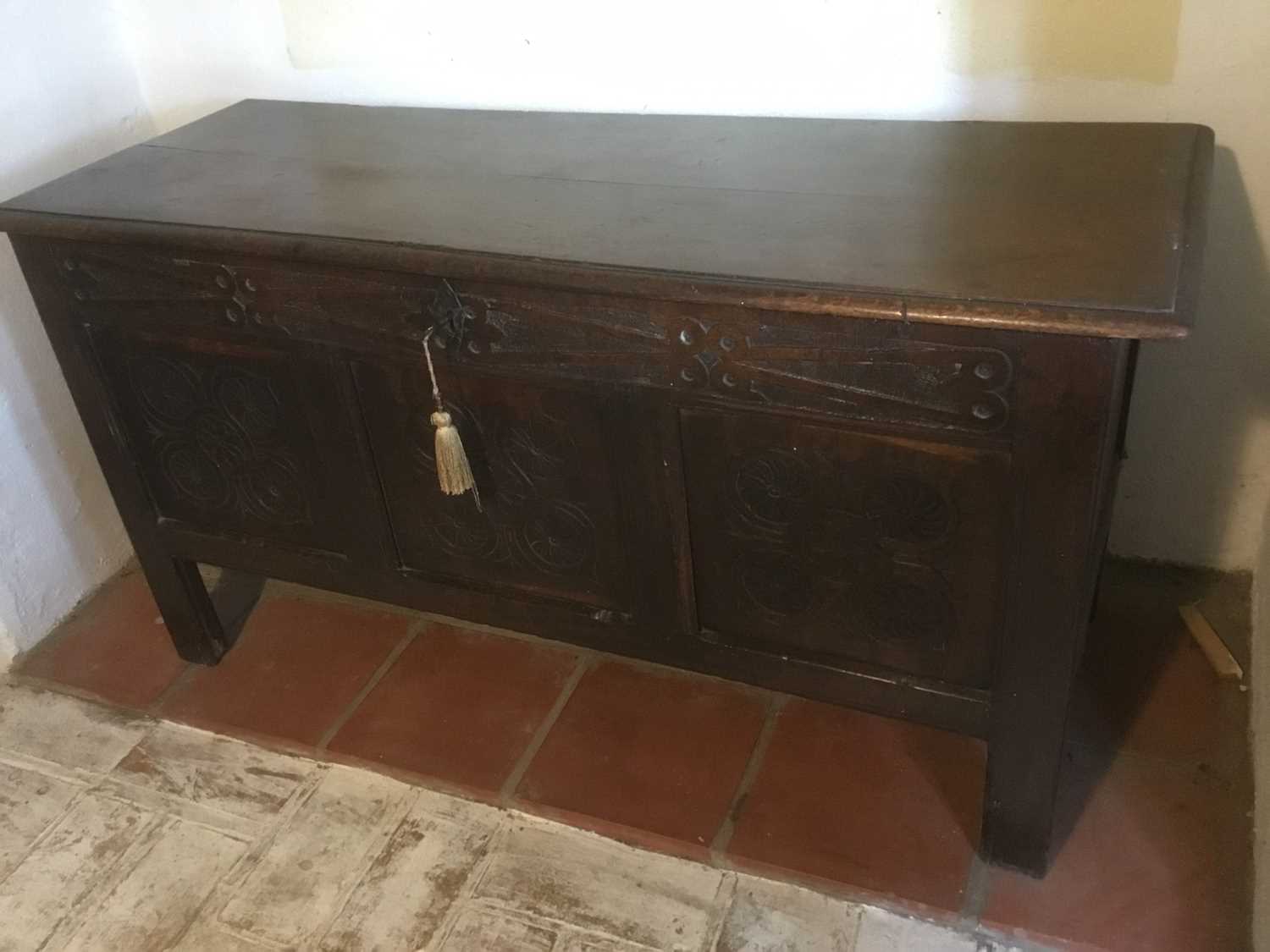 Lot 1625 - Late 17th century carved oak coffer, with moulded plank top and relief carved frieze over triple panel front on stiles, 108cm wide x 43cm deep x 64cm high