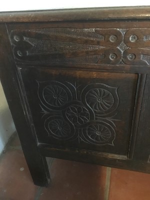 Lot 1625 - Late 17th century carved oak coffer, with moulded plank top and relief carved frieze over triple panel front on stiles, 108cm wide x 43cm deep x 64cm high