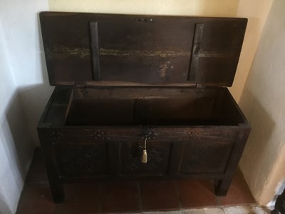 Lot 1625 - Late 17th century carved oak coffer, with moulded plank top and relief carved frieze over triple panel front on stiles, 108cm wide x 43cm deep x 64cm high