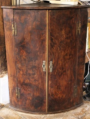 Lot 1631 - George III burr elm bow front corner cupboard with shelved interior and brass H hinges, 69cm wide x 43cm deep x 88cm high